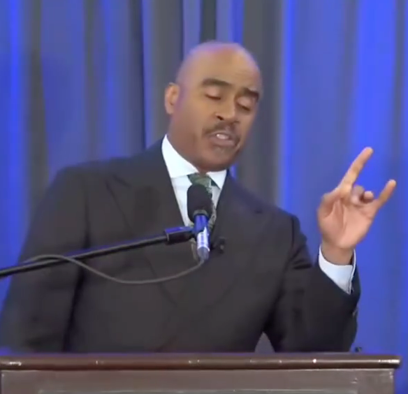 Apostle Gino Jennings showing hand sign?